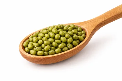Wooden Spoon Filled With Raw Mung Beans