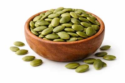 Wooden Bowl Filled With Raw Green Pumpkin Seeds
