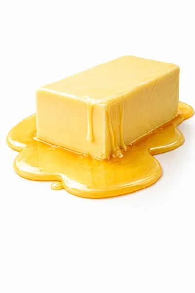 Block Of Butter Melting On White Background