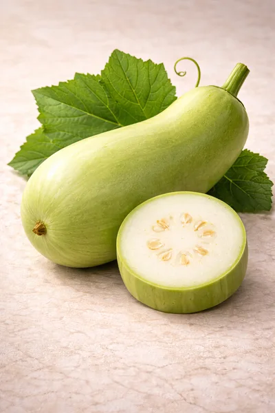 Fresh Whole And Sliced Calabash Gourd With Leaves