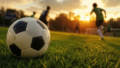 Soccer Ball Resting On Grass During Sunset Match