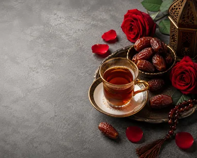 Ramadan Celebration With Dates Tea And Red Roses