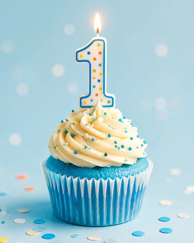 First Birthday Cupcake With Lit Number One Candle