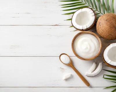 Coconut Yogurt In A Wooden Bowl With Fresh Coconuts