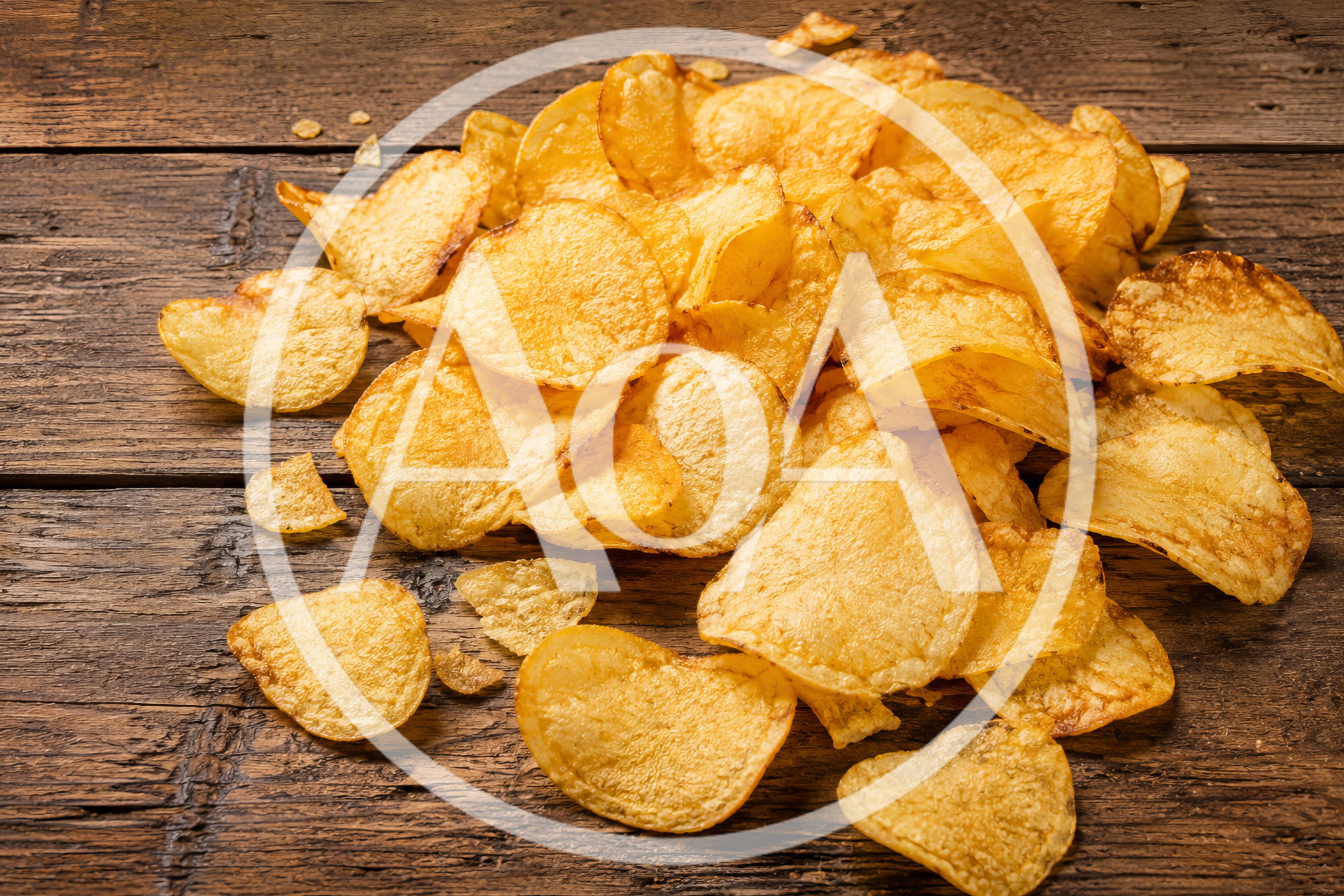 Pile Of Crispy Potato Chips On Rustic Wooden Table