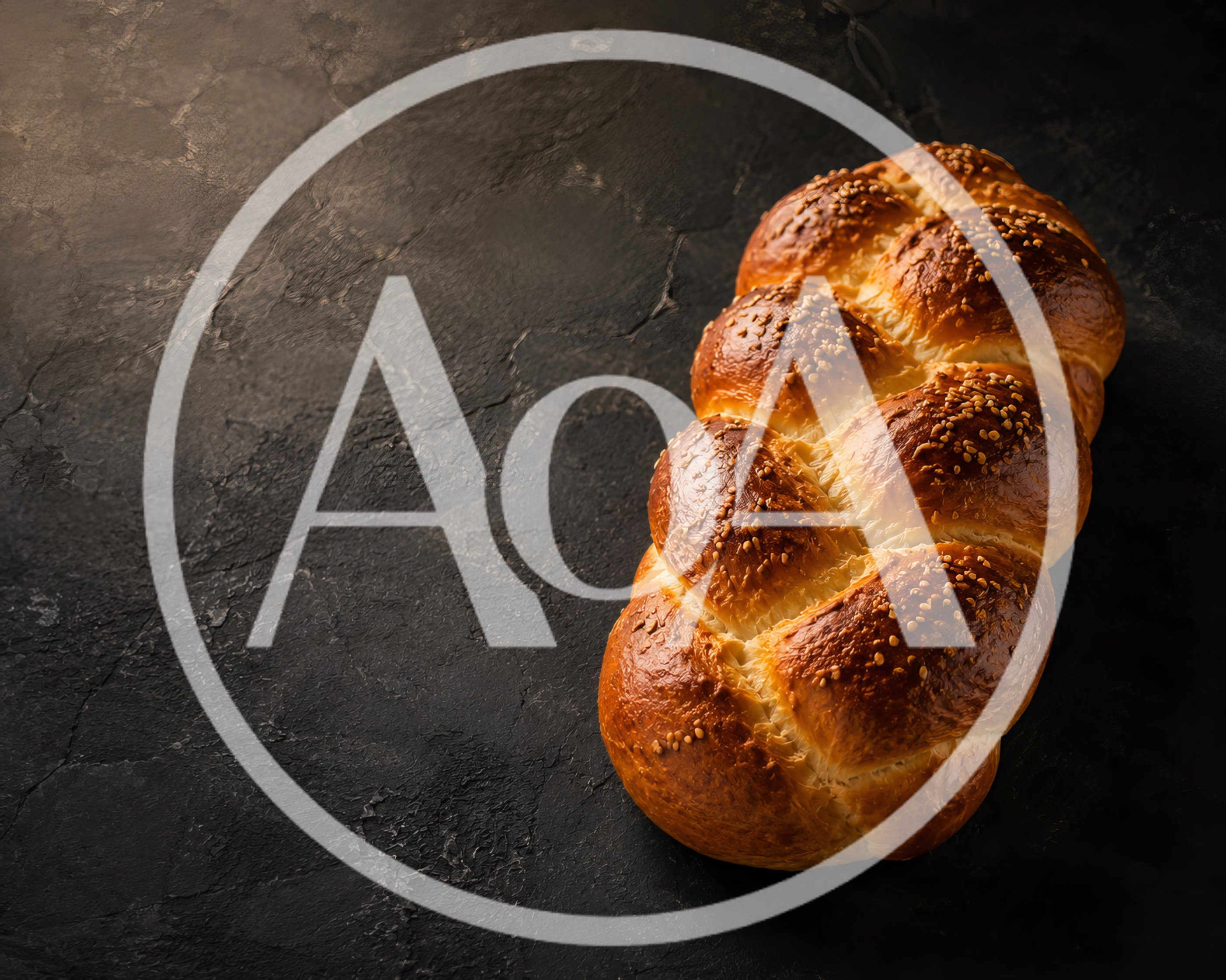 Freshly Baked Braided Challah Bread on Dark Surface