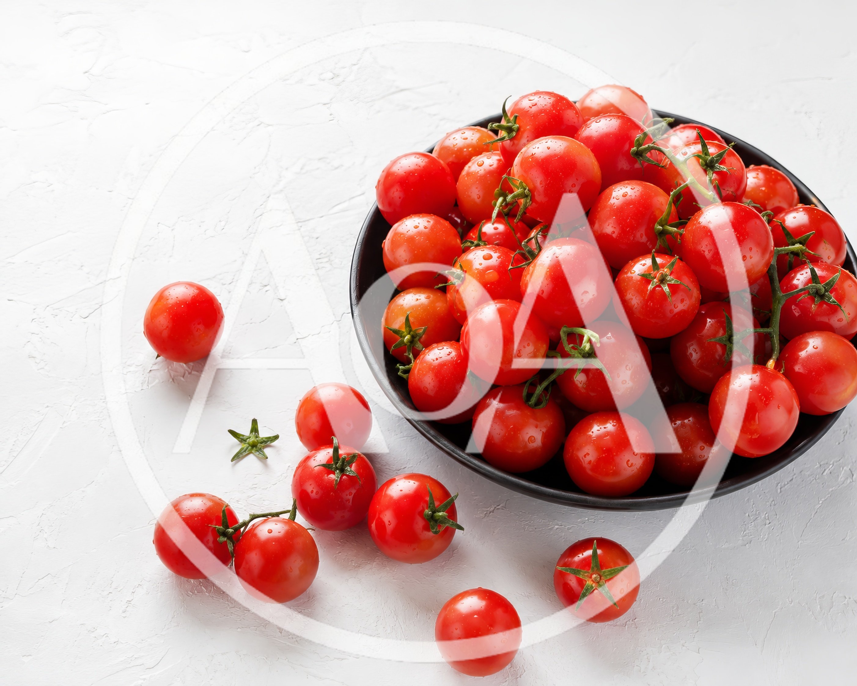 Fresh Red Cherry Tomatoes in a Black Bowl