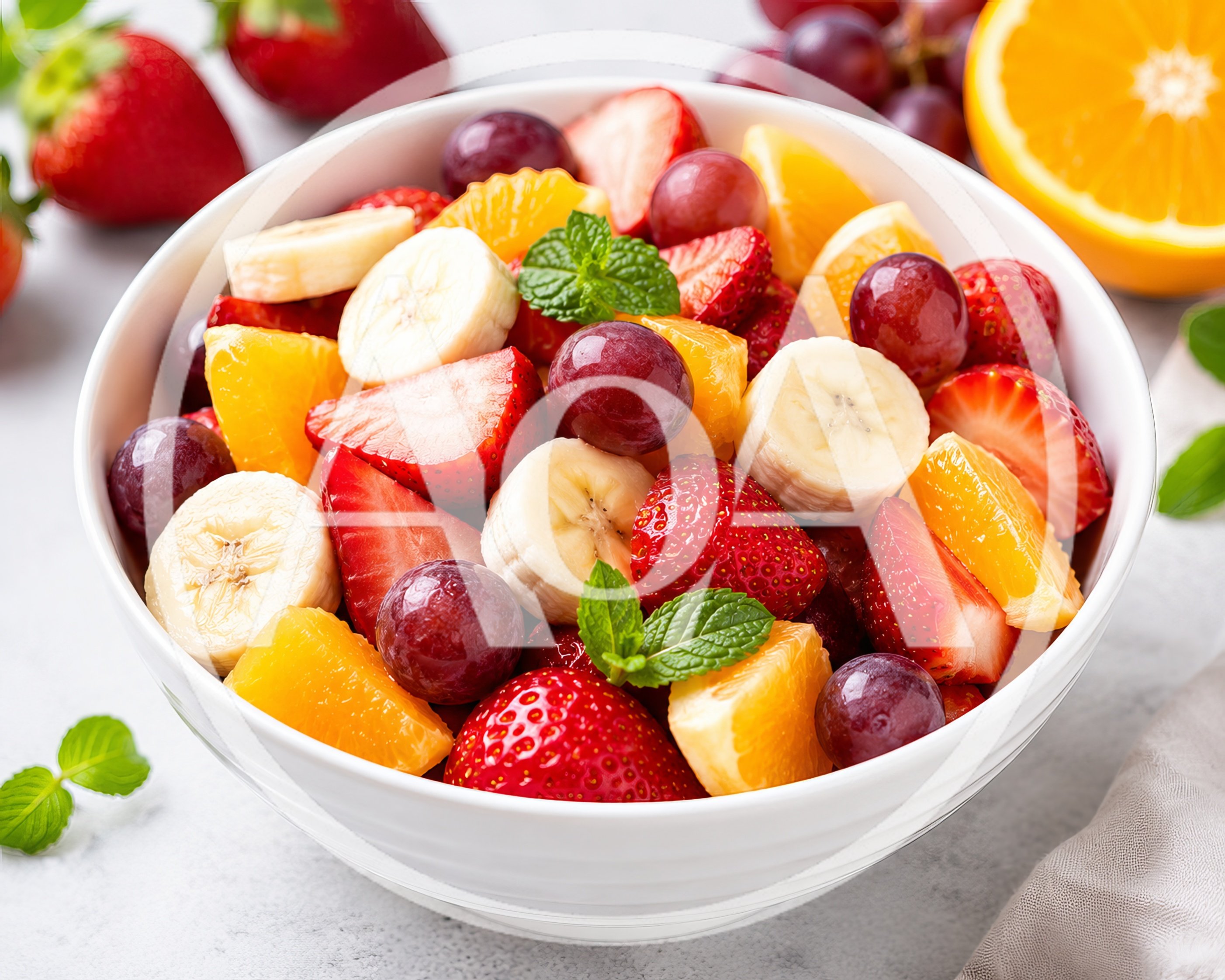 Fresh Fruit Salad Bowl with Strawberries Bananas and Grapes