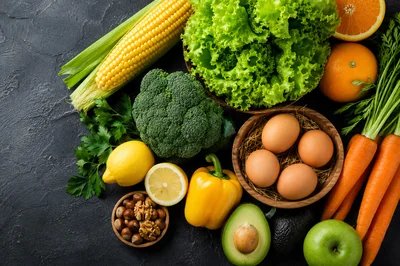 Fresh Organic Vegetables and Fruits on Dark Background