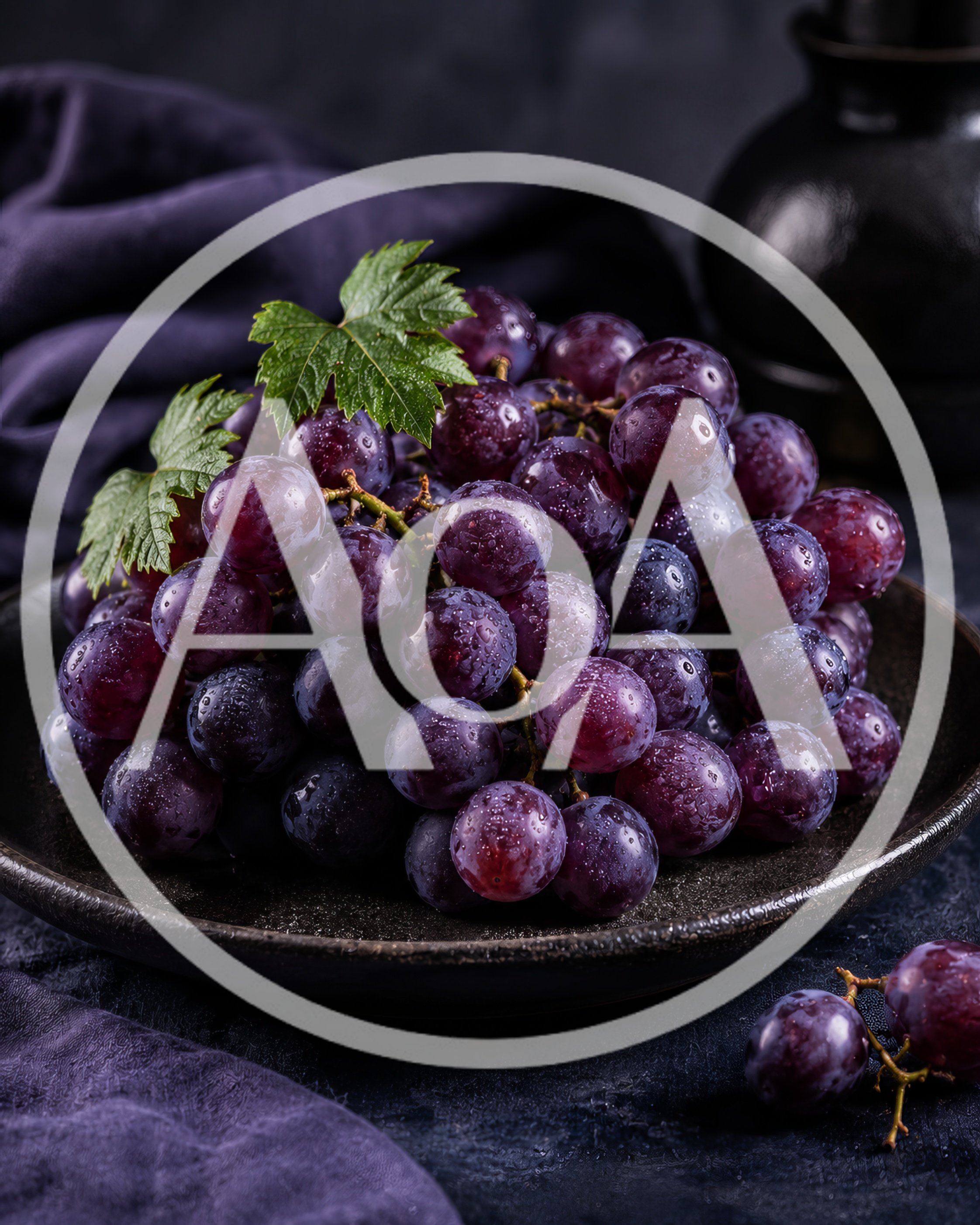 Fresh Red Grapes on a Dark Ceramic Plate