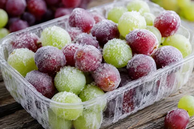 Frozen Red and Green Grapes in Plastic Container