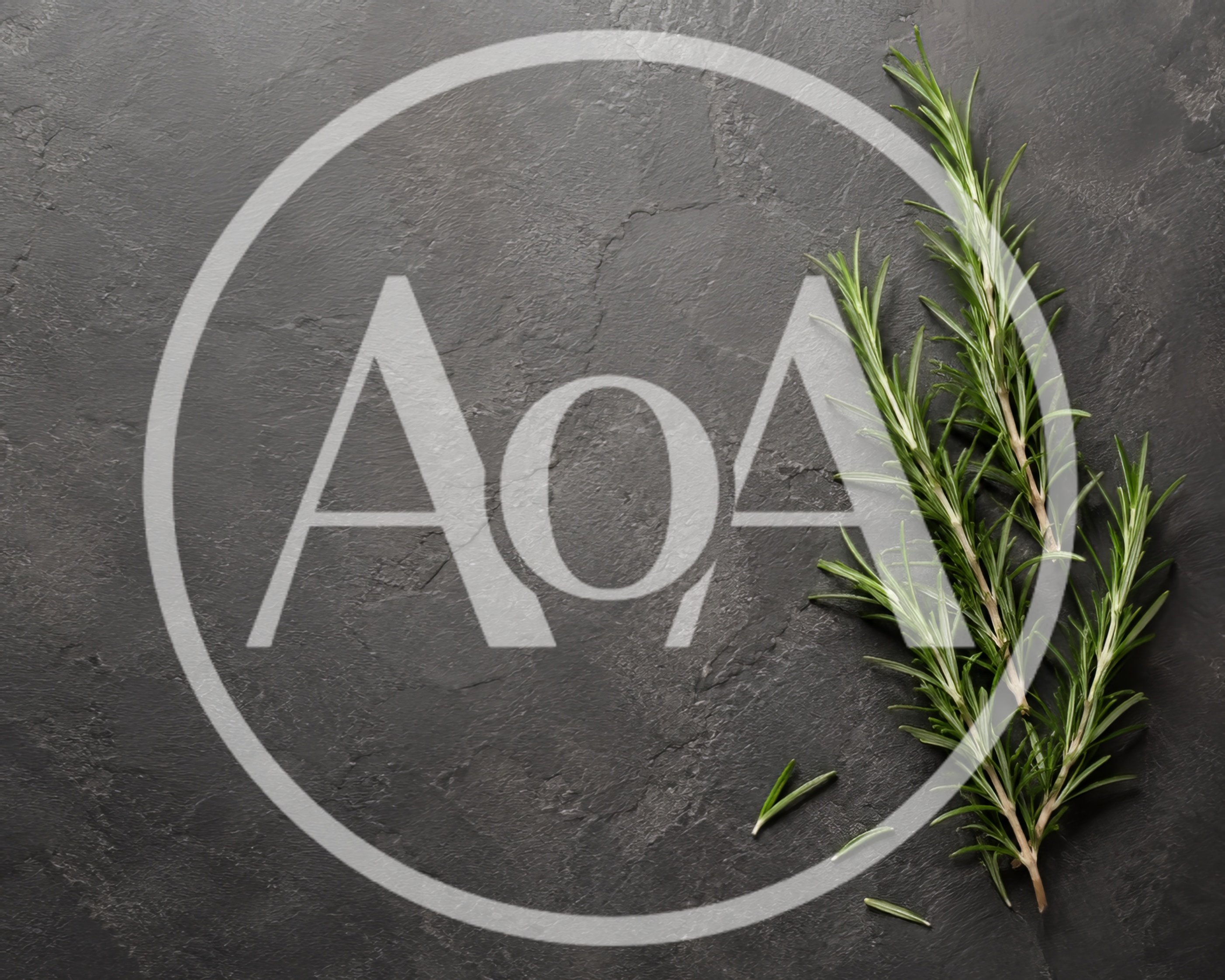 Fresh Rosemary Sprigs on Dark Slate Background