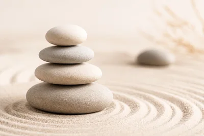 Stacked Zen Stones On Raked Sand