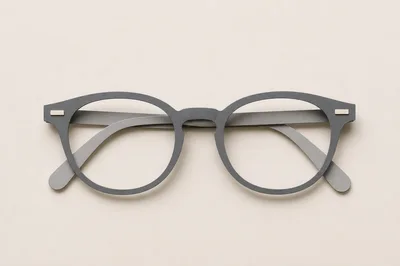 Minimalist Grey Eyeglasses On A Neutral Background