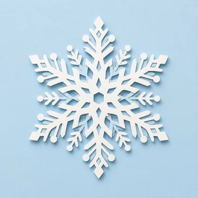 White Paper Snowflake Ornament on Light Blue Background