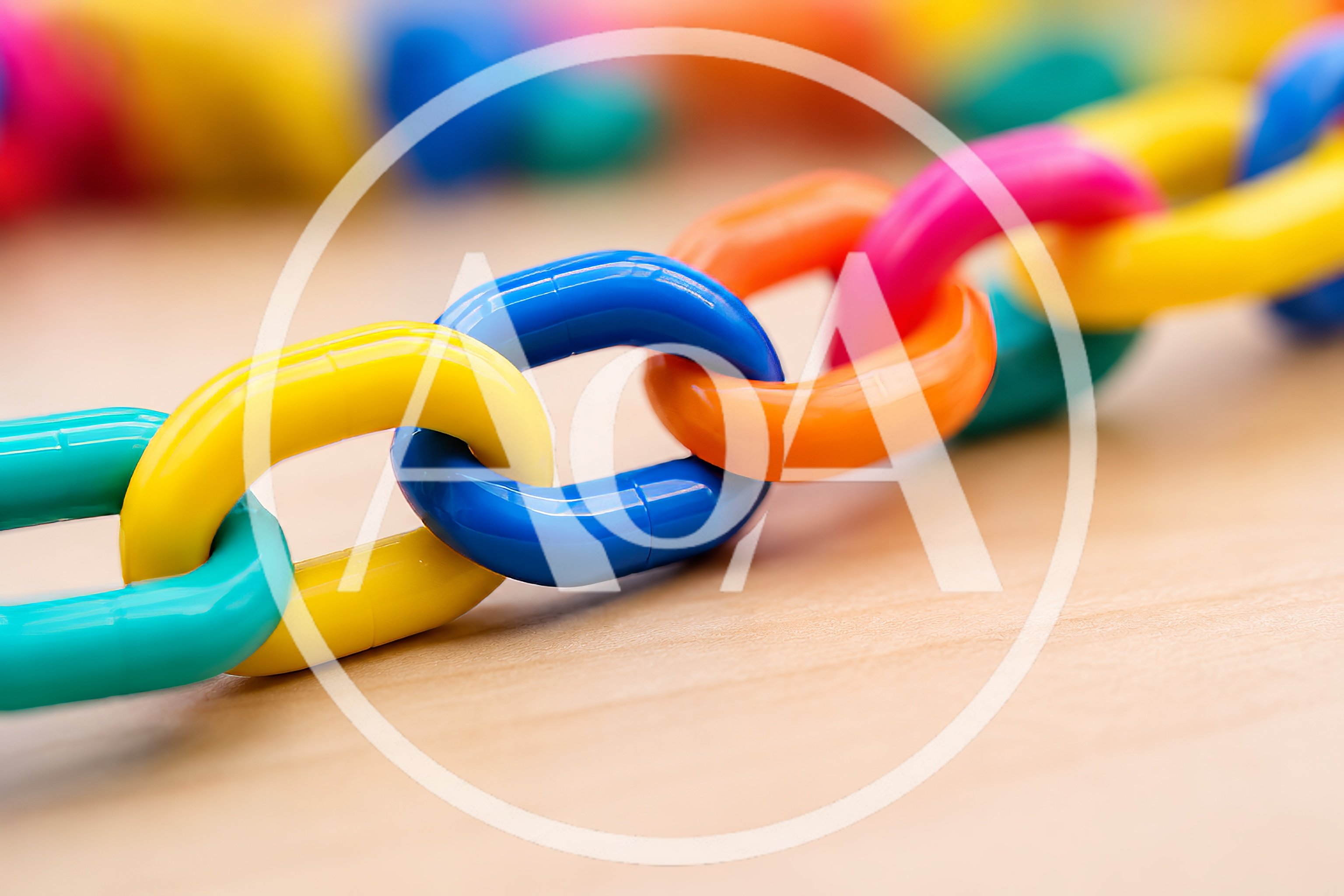 Colorful Plastic Chain Links On Wooden Surface
