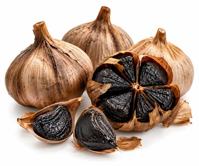 Whole And Peeled Black Garlic Bulbs