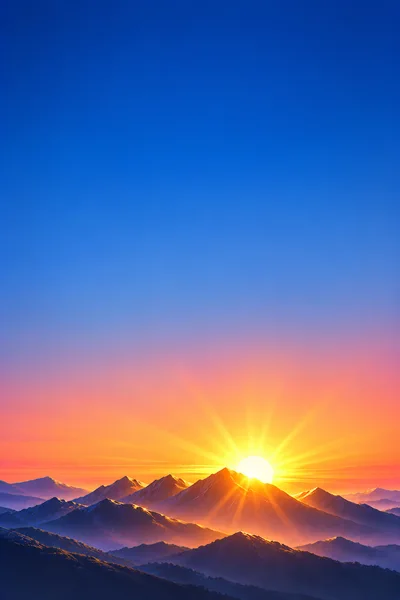 Majestic Mountain Range At Sunrise With Golden Sunburst