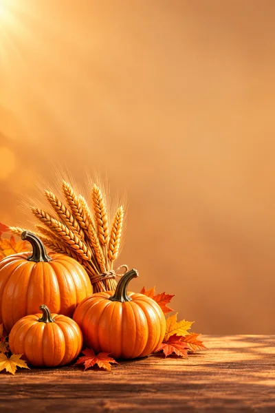 Autumn Harvest Pumpkins With Wheat And Maple Leaves