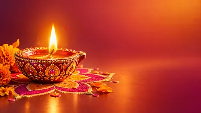Diwali Diya Lamp With Rangoli And Marigold Flowers