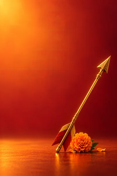 Golden Arrow With Marigold Flower On Red Background