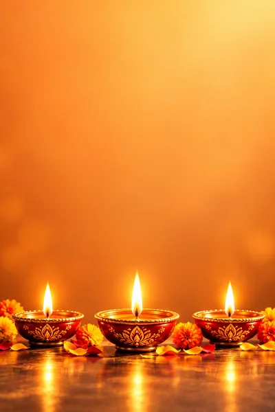 Three Lit Diya Lamps For Diwali Celebration
