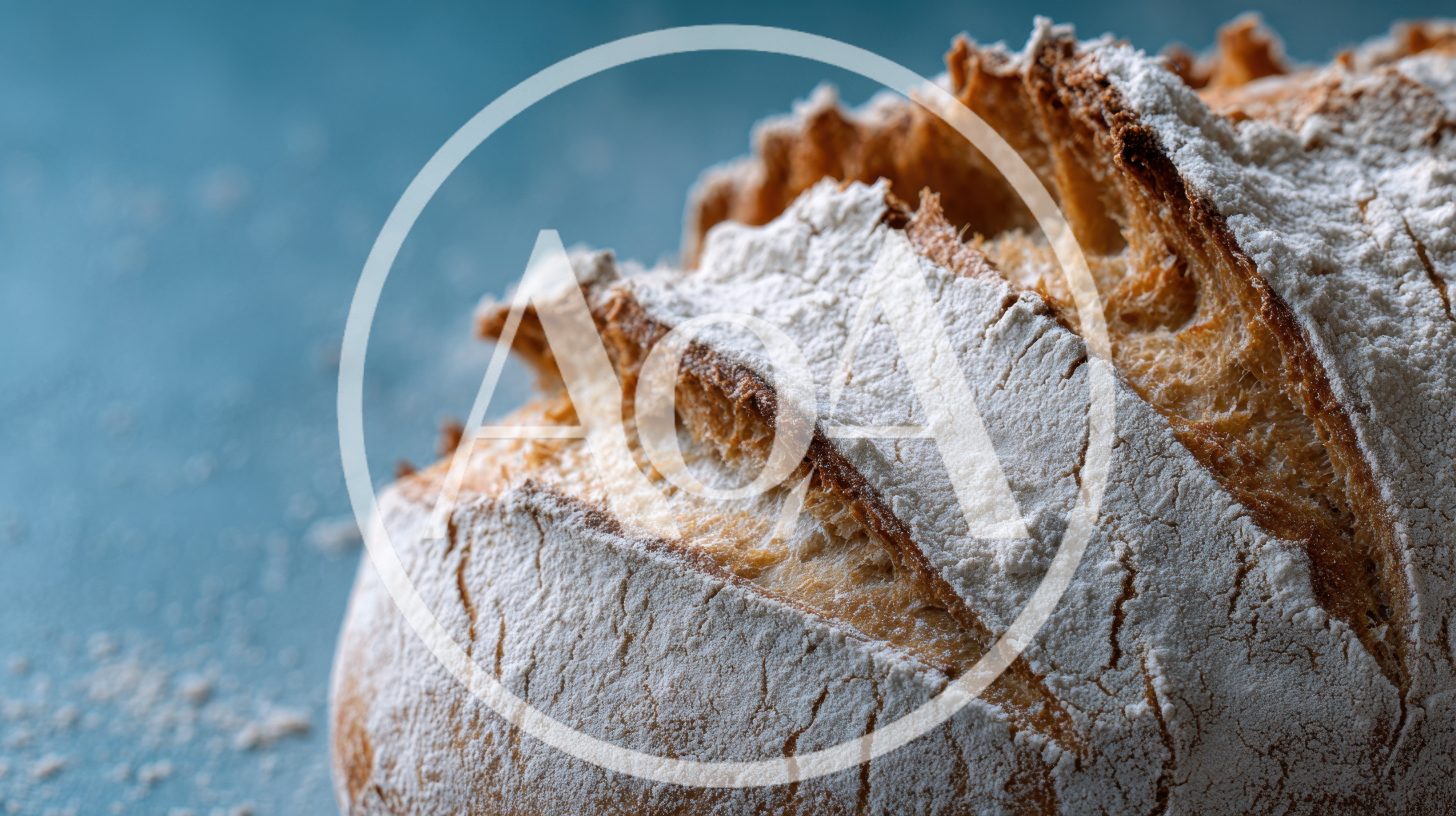 Freshly Baked Sourdough Bread Loaf On Blue Surface