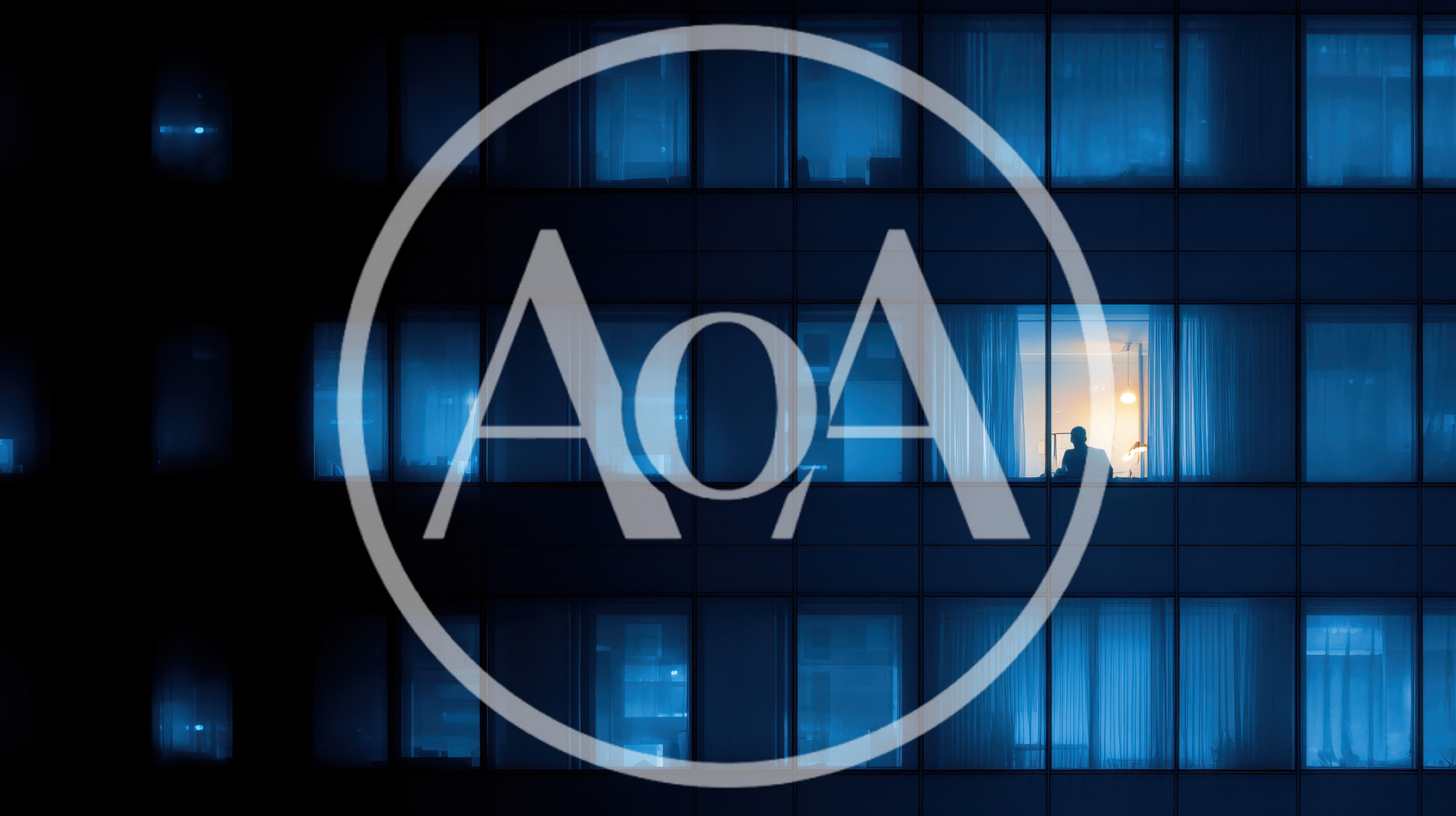 Silhouette Of A Person Working Late In Office Building