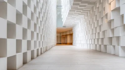 Modern Architectural Corridor With Geometric White Block Walls