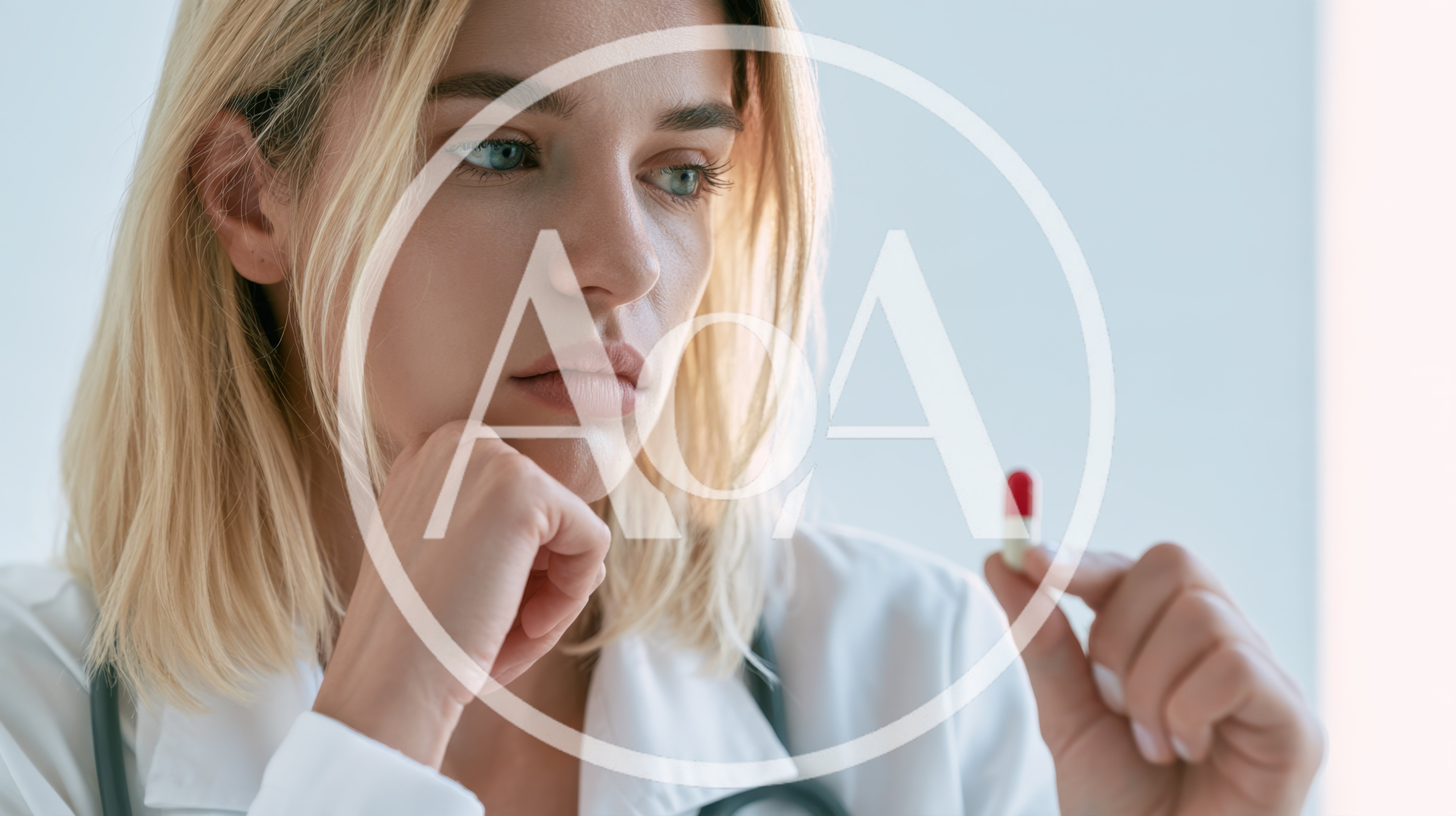 Female Doctor Holding A Pill In Thought