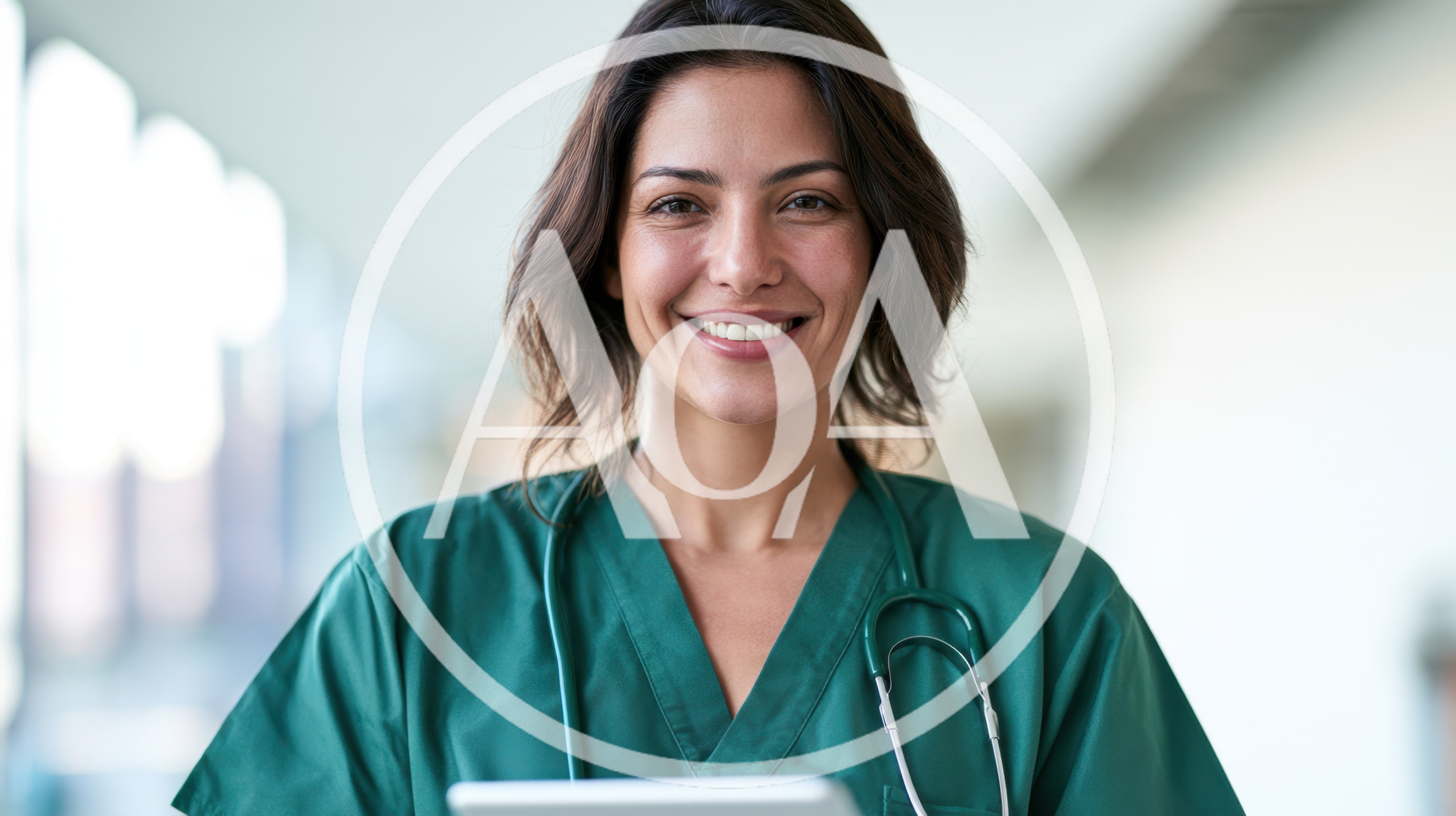 Smiling Female Doctor Holding Tablet In Hospital