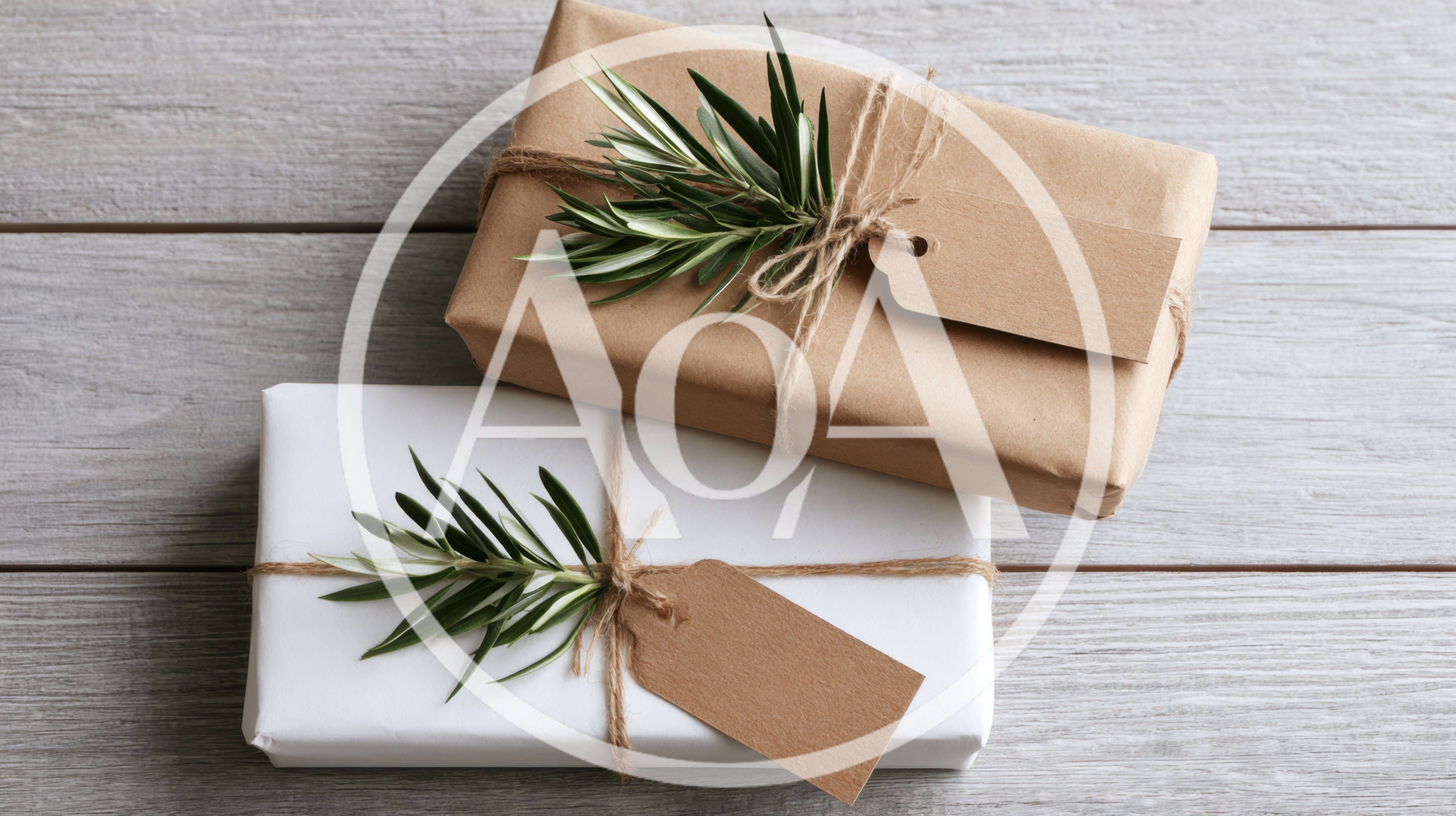 Two Wrapped Gift Boxes With Olive Sprigs