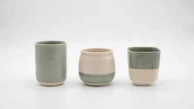 Three Ceramic Cups On A White Background