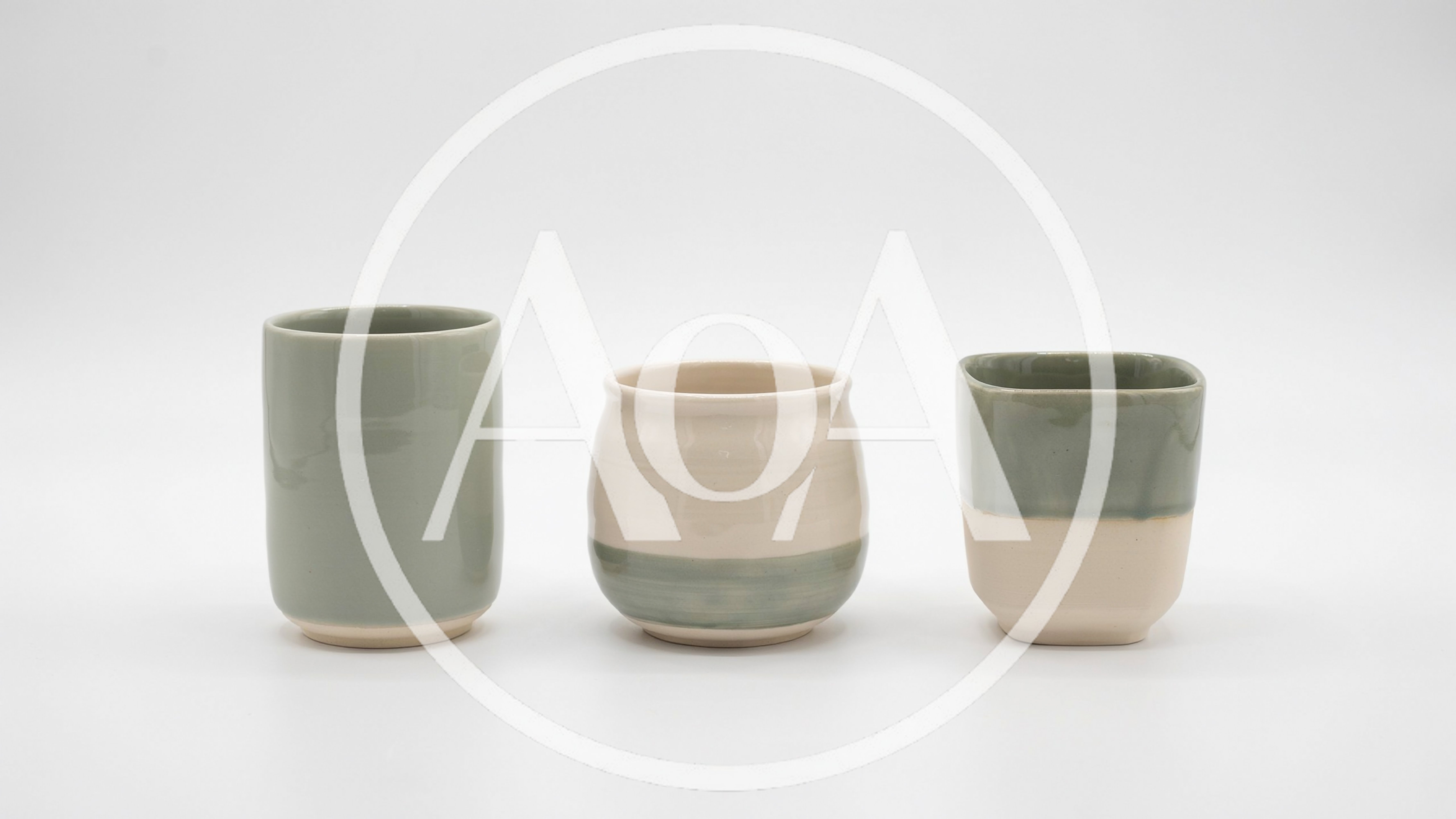 Three Ceramic Cups On A White Background
