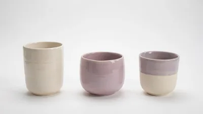 Three Handmade Ceramic Cups On White Background