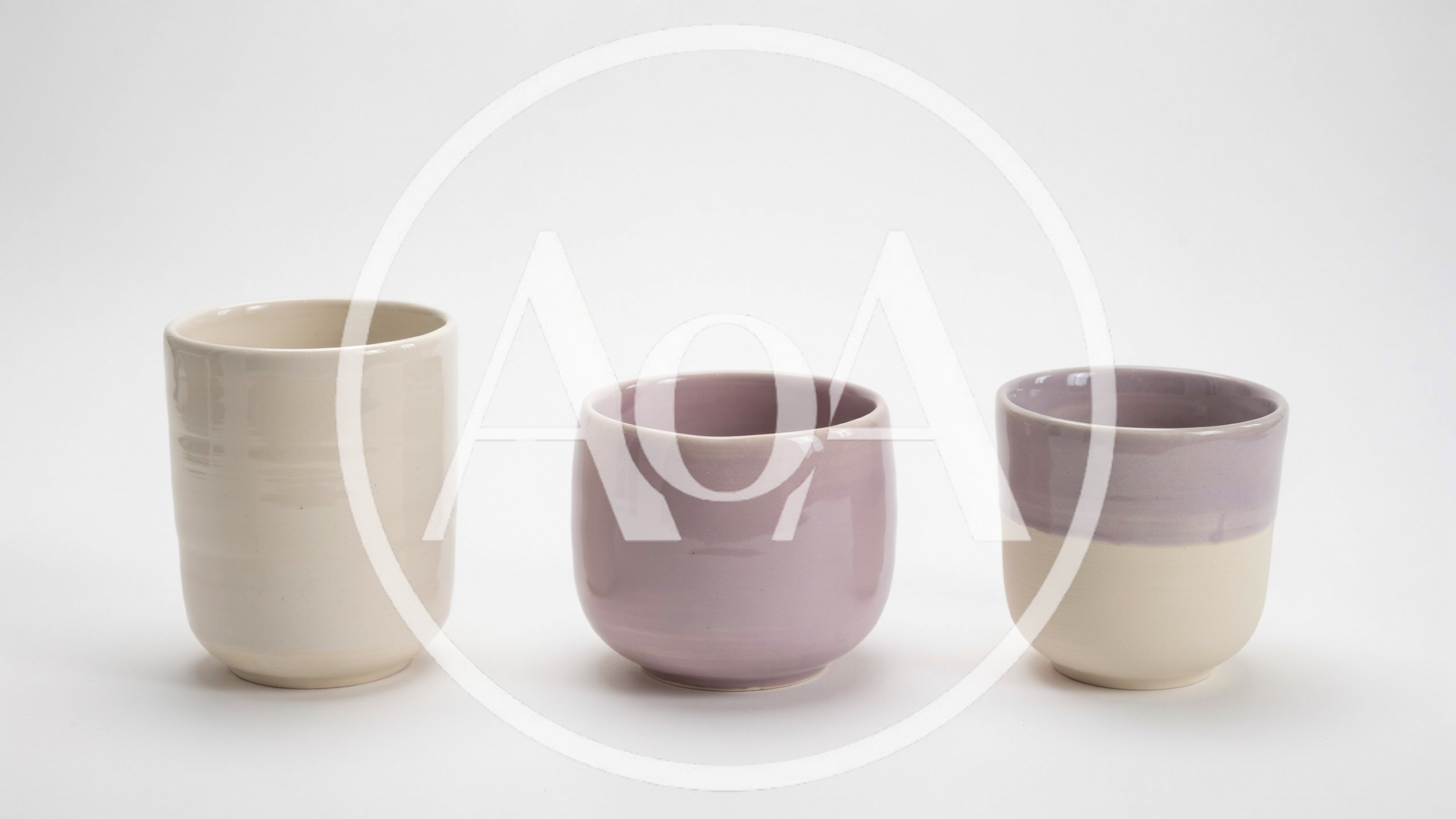 Three Handmade Ceramic Cups On White Background