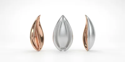Three Abstract Metallic Sculptures On White Background