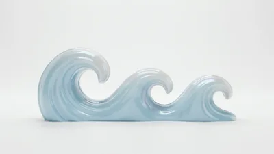 Iridescent Ceramic Wave Sculpture On White Background