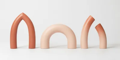 Minimalist Ceramic Arch Vases on White Background