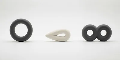Abstract Ceramic Sculptures Arranged On A White Background