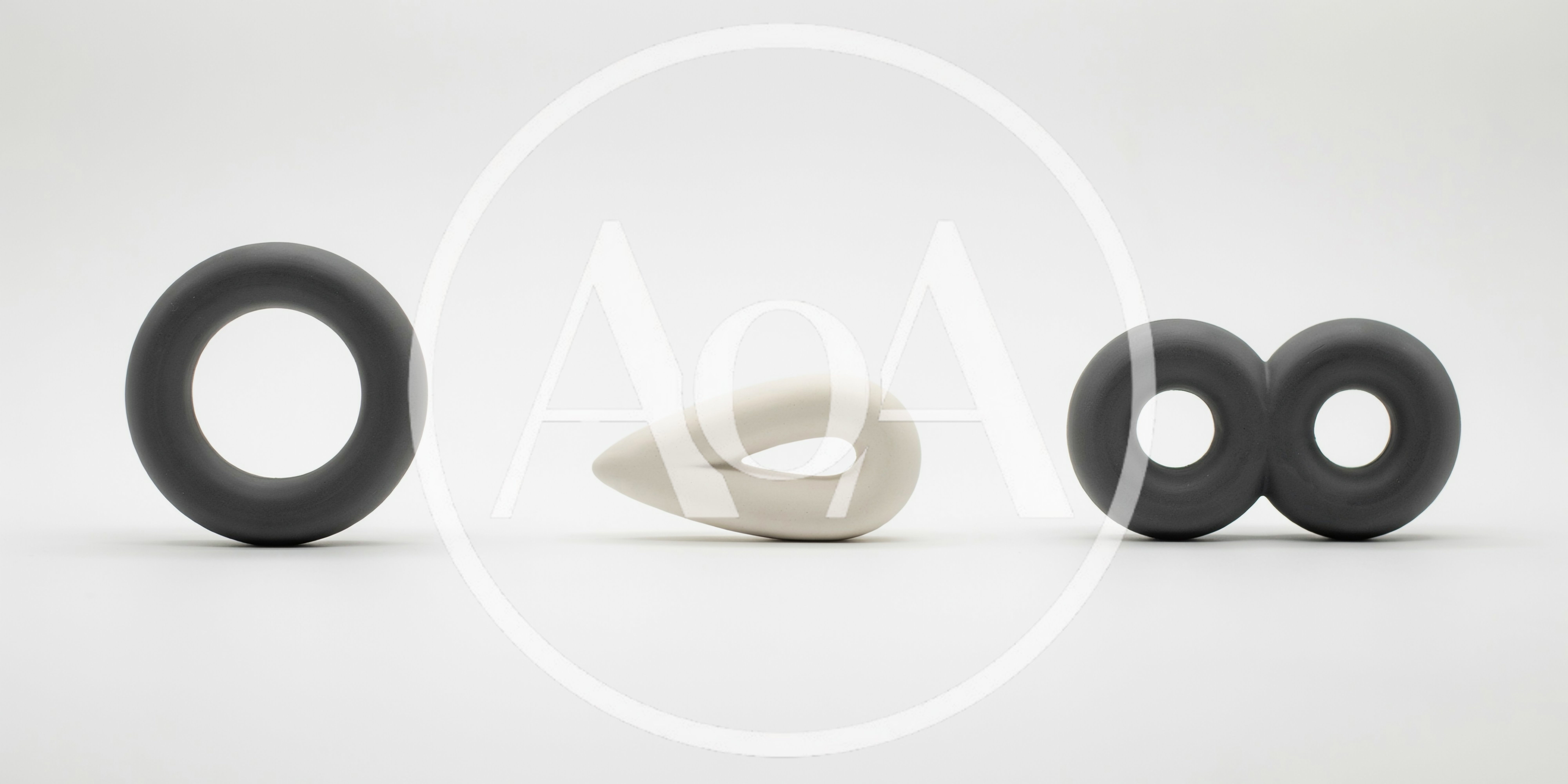 Abstract Ceramic Sculptures Arranged On A White Background