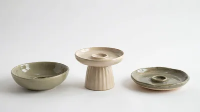 Three Handmade Ceramic Candle Holders On White Background