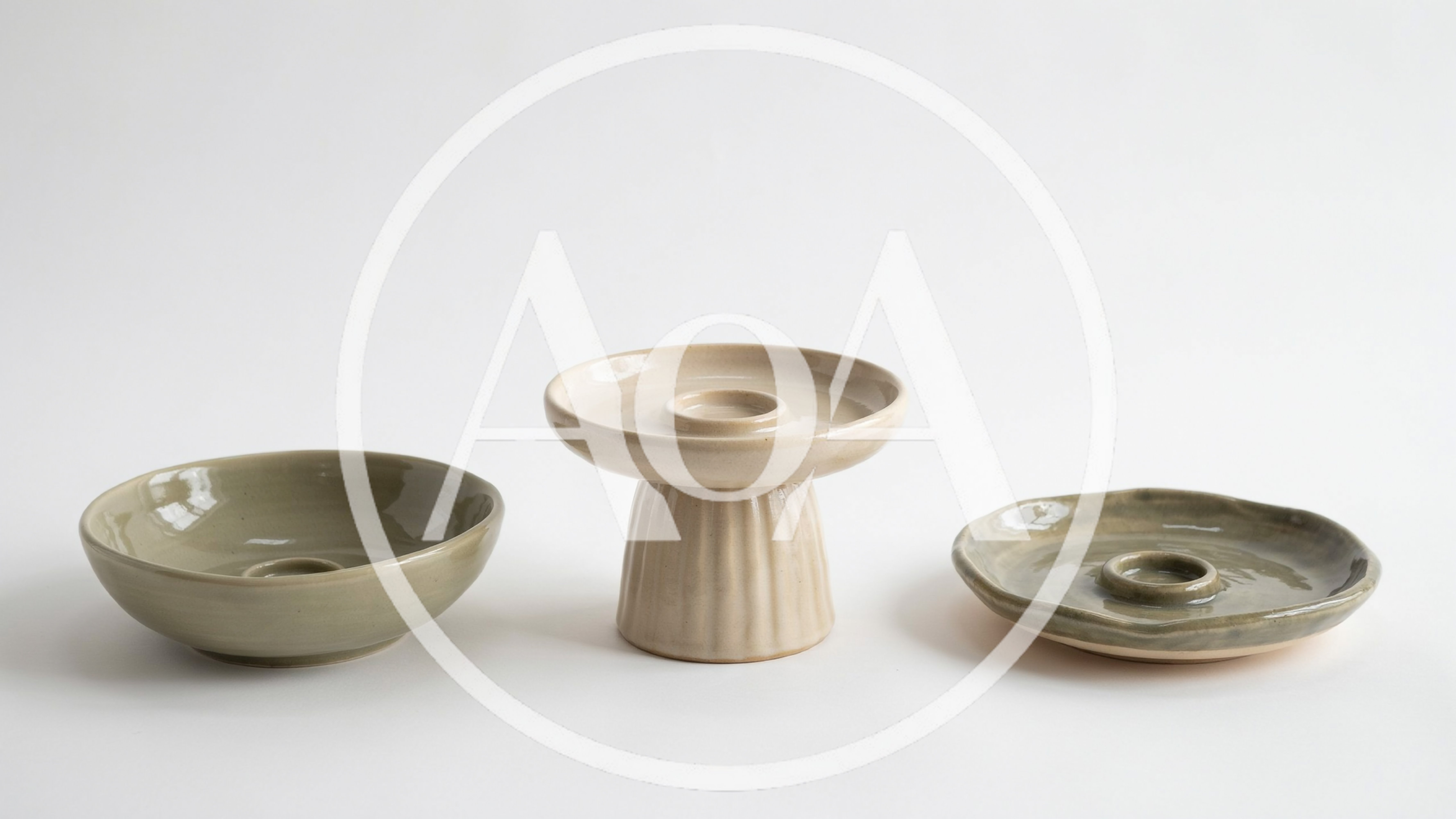 Three Handmade Ceramic Candle Holders On White Background