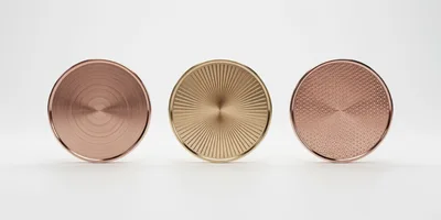 Three Metallic Circular Discs With Distinct Surface Textures