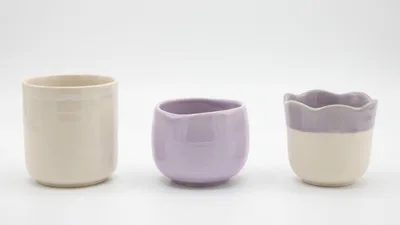 Three Handmade Ceramic Cups On White Background