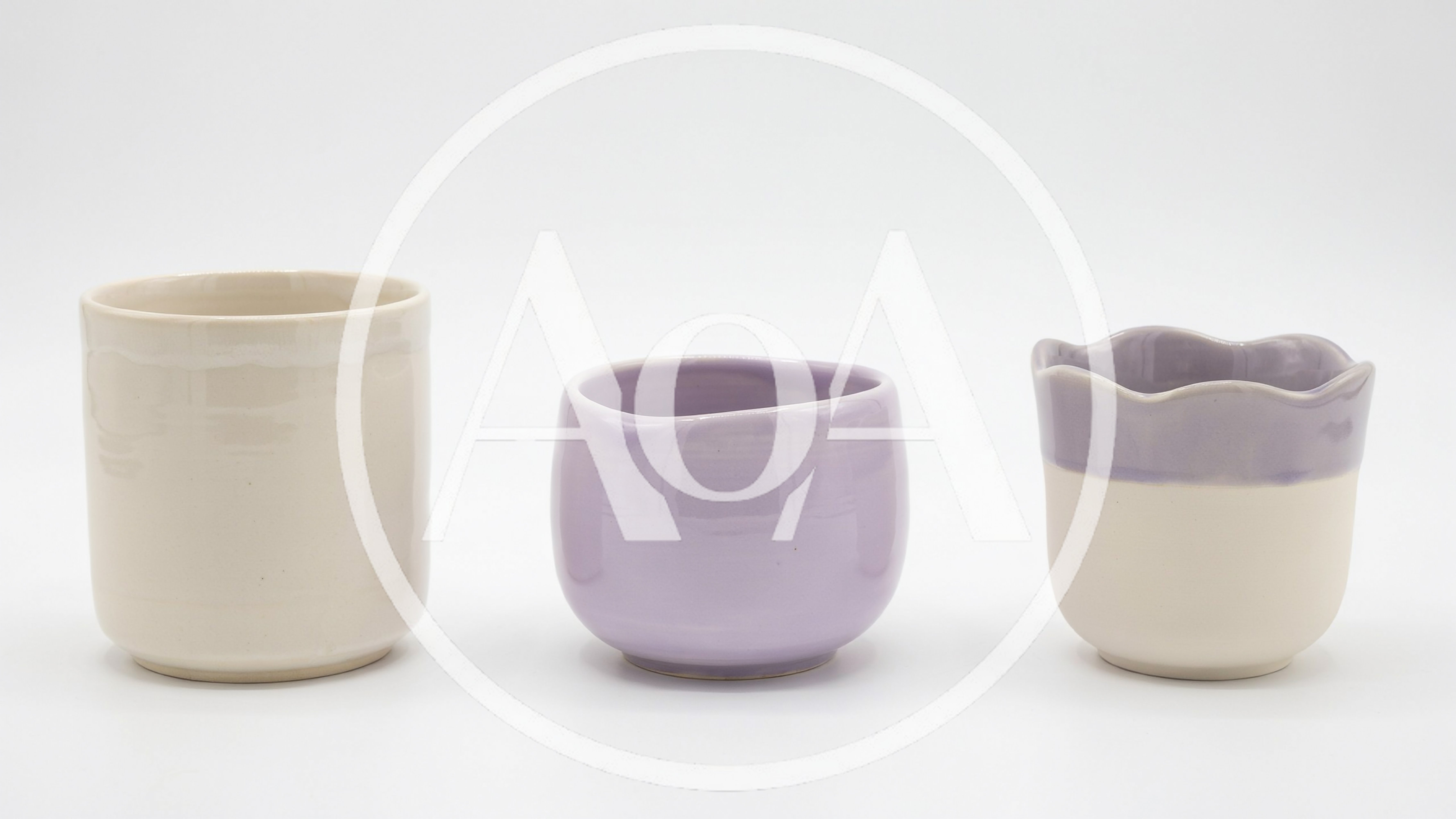 Three Handmade Ceramic Cups On White Background