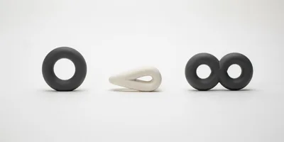 Abstract Ceramic Sculptures Arranged On A White Background