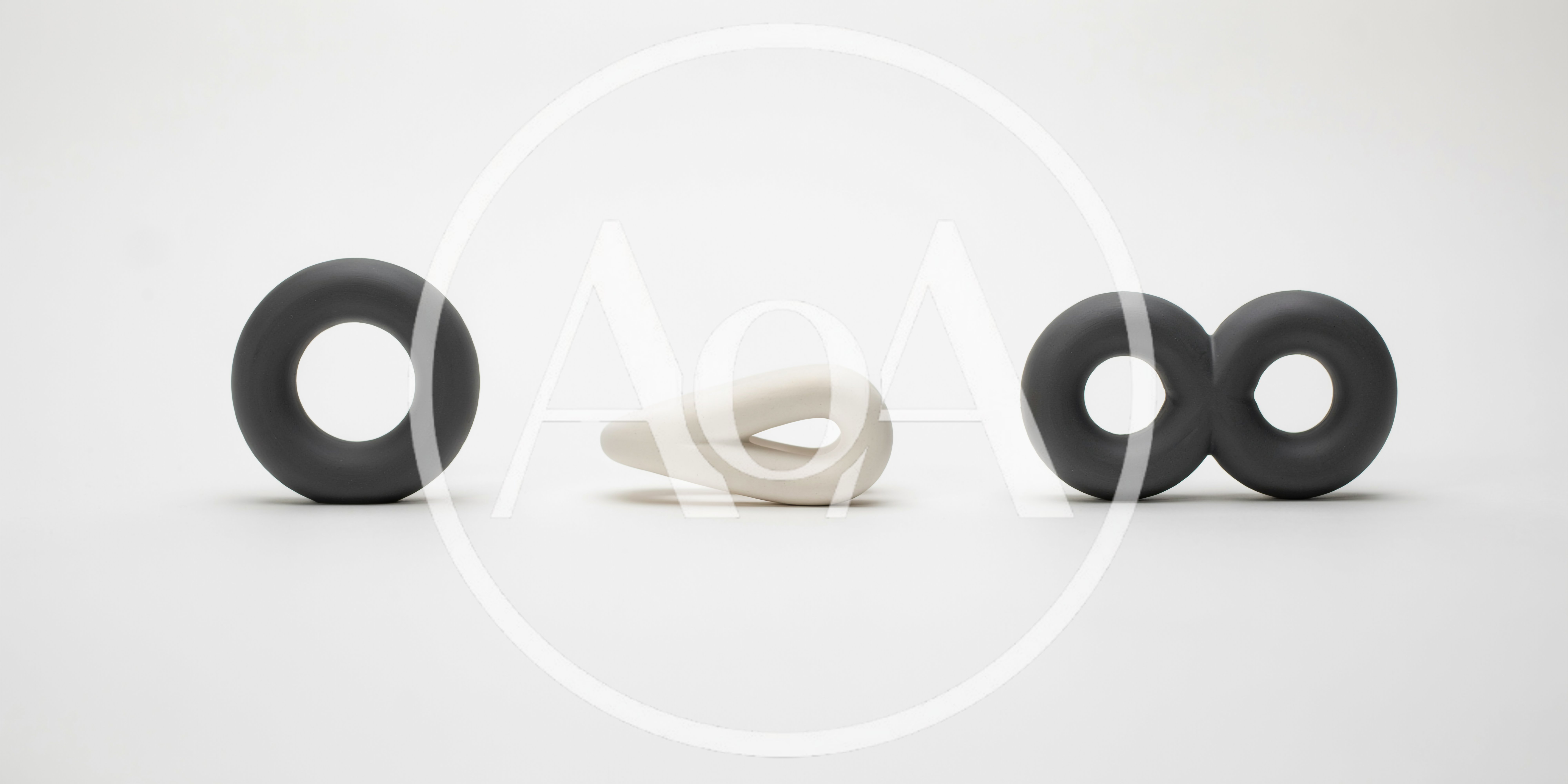 Abstract Ceramic Sculptures Arranged On A White Background