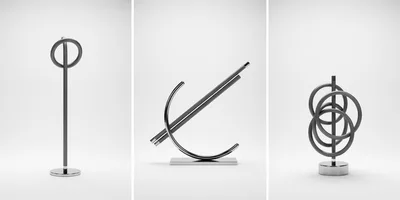 Three Modern Minimalist Metal Sculptures On White Background