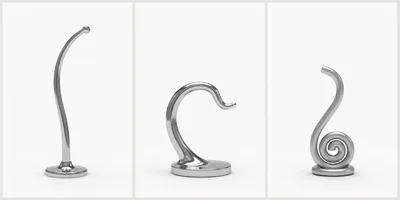 Three Abstract Chrome Sculptures On White Background